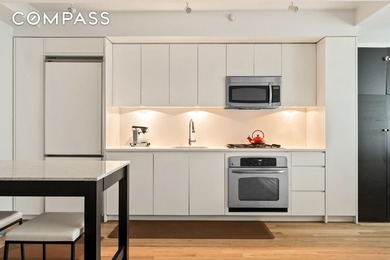 *Welcome to Residence 15F, a versatile and sleek 845-square-foot - photo 3