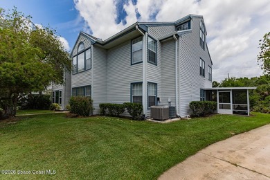 This two-story condo has high vaulted ceilings, skylights, and a - photo 1