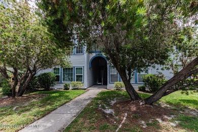 This two-story condo has high vaulted ceilings, skylights, and a - photo 2