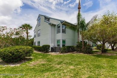 This two-story condo has high vaulted ceilings, skylights, and a - photo 4