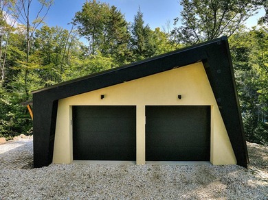 Nichee sur les rives paisibles du lac a l'Ile, cette residence - photo 6