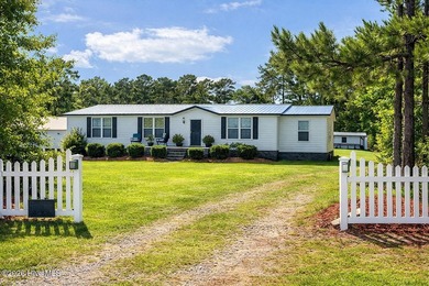 Coastal charm meets modern updates in this water access - photo 1