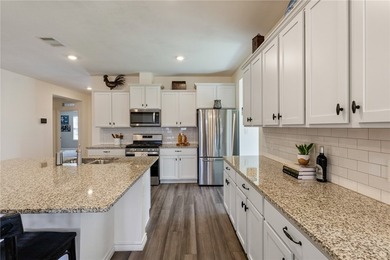This beautiful 4 bedroom, 2 bath home is located in the - photo 3
