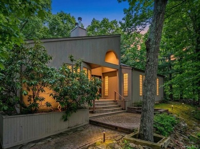Tucked away on a beautifully landscaped 3/4-acre property, this - photo 2