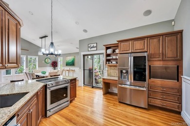 Tucked away on a beautifully landscaped 3/4-acre property, this - photo 8