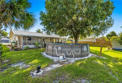 Metal roof. Mature oaks. A yard that actually gives you room to - photo 25