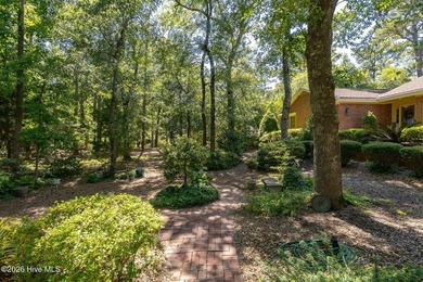 Nestled at the end of a private cul-de-sac and overlooking the - photo 1
