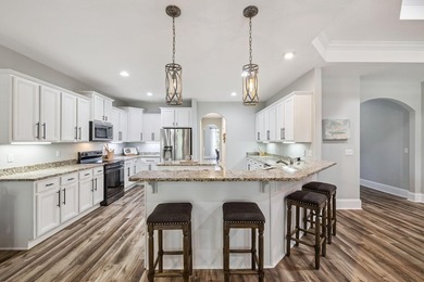 Love to entertain? This beautifully updated home in the gated - photo 1
