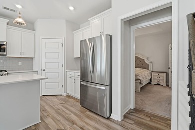Built in 2024 on a private, wooded homesite with natural - photo 12