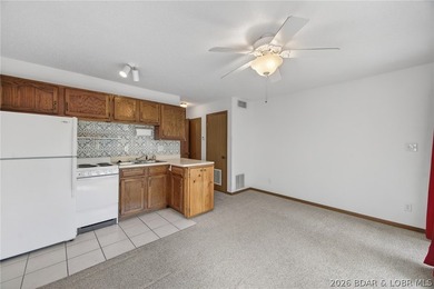 AFFORDABLE LAKEFRONT, Low HOA fees, 1 bedroom, 1 bath end-unit - photo 13
