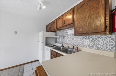 AFFORDABLE LAKEFRONT, Low HOA fees, 1 bedroom, 1 bath end-unit - photo 16