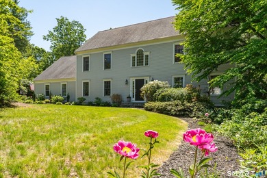 Beautifully sited on a fabulous private lot in the highly - photo 1