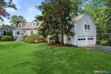 Privately sited on a flat .39-acre lot with mature landscaping - photo 1