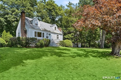 Privately sited on a flat .39-acre lot with mature landscaping - photo 2