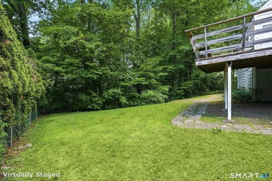 Privately sited on a flat .39-acre lot with mature landscaping - photo 6
