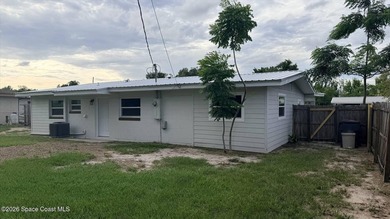 Beautifully remodeled concrete block 4/2 home with a new metal - photo 3