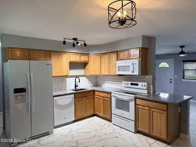Beautifully remodeled concrete block 4/2 home with a new metal - photo 6