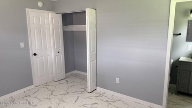 Beautifully remodeled concrete block 4/2 home with a new metal - photo 10