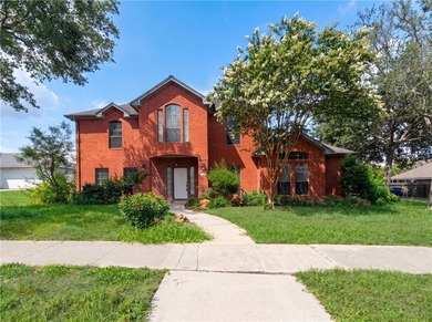This Corpus Christi two-story home offers a patio, and a two-car - photo 1
