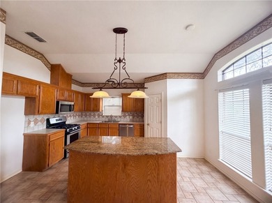 This Corpus Christi two-story home offers a patio, and a two-car - photo 2