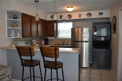 Welcome to Coastal living! This charming townhome is located on - photo 8