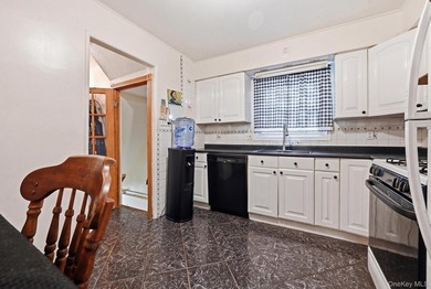 Beutifully Renovated 2 Family High Ranch, 6 Bedrooms, 4 Full - photo 6