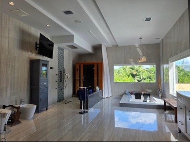Situated on an expansive 2.23-acre estate, this exceptional - photo 14