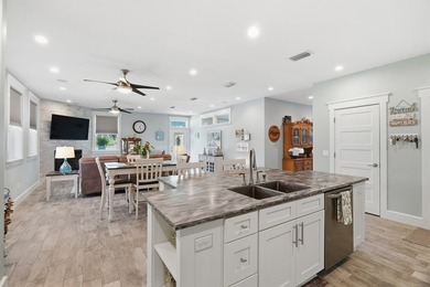 Enjoy coastal breezes from the covered front porch or unwind on - photo 22