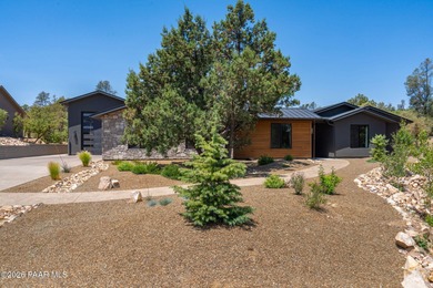 Stunning single level custom home on almost an acre in town!