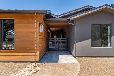 Stunning single level custom home on almost an acre in town!