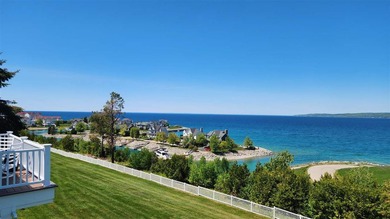 Perched above the Lake Michigan shoreline, this stunning - photo 3
