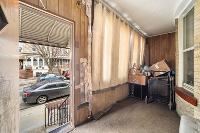 Solid brick two-family home, currently tenant-occupied-perfect - photo 3