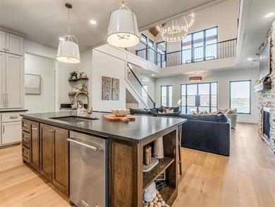 Completed in 2025, this exceptional custom lake home in the - photo 12