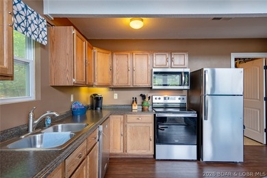 Lake living doesn't get much better than this! Nestled in a - photo 24