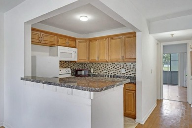 This 1st floor unit has a freshly painted interior and is a safe - photo 11
