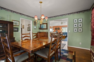 Set on 3.55 waterfront acres, this one-level custom home offers