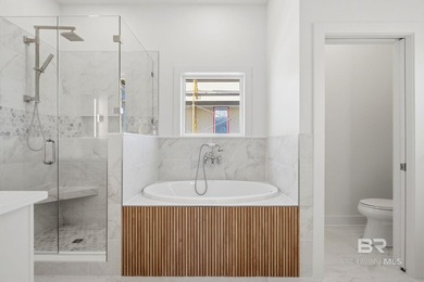 Newly completed in 2026, this stunning corner-lot beach home - photo 50
