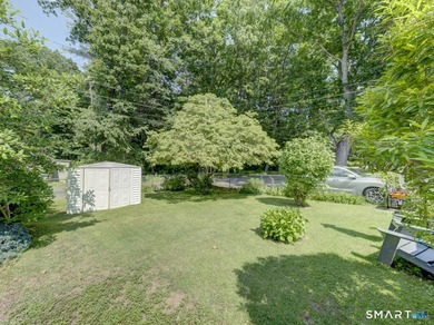 Charming 2-bedroom ranch-style home on a lovely lake offers a - photo 27