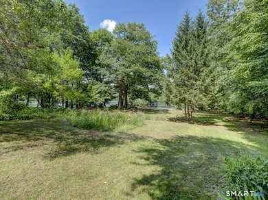 Charming 2-bedroom ranch-style home on a lovely lake offers a - photo 31
