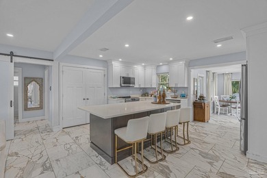 Enjoy coastal living in this well-maintained, fully renovated - photo 1