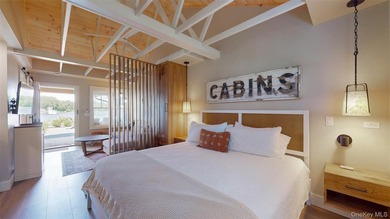Welcome to this rare, income-producing waterfront retreat in - photo 6