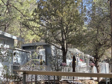 Nicely remodeled home featuring mature trees, a spacious deck