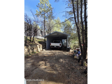 Nicely remodeled home featuring mature trees, a spacious deck