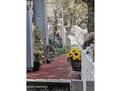 Nicely remodeled home featuring mature trees, a spacious deck