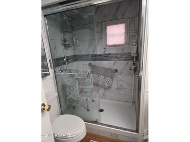 Nicely remodeled home featuring mature trees, a spacious deck