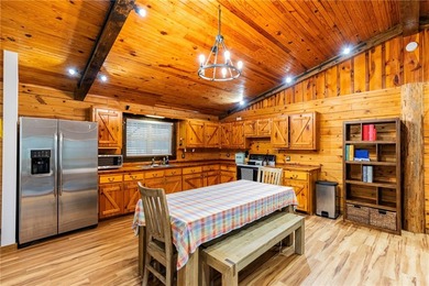 True Ozark living in a real log home that comes with a boat slip - photo 21