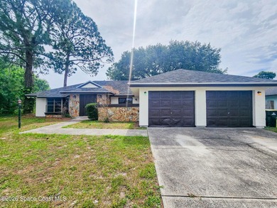 Welcome to this updated 3-bedroom, 2-bath home in Northwest Palm - photo 2