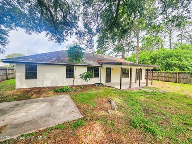 Welcome to this updated 3-bedroom, 2-bath home in Northwest Palm - photo 3
