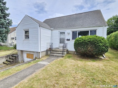 Cape cod style home with newer roof, vinyl siding. Located in a - photo 1
