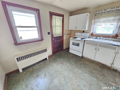 Cape cod style home with newer roof, vinyl siding. Located in a - photo 6